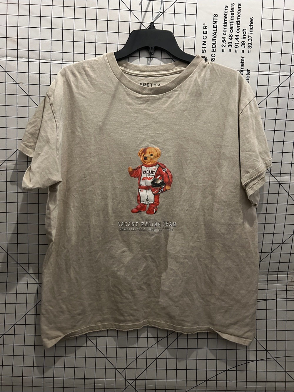 Pretty Vacant Vintage-Inspired Bear Racing Graphic Tee - Cream